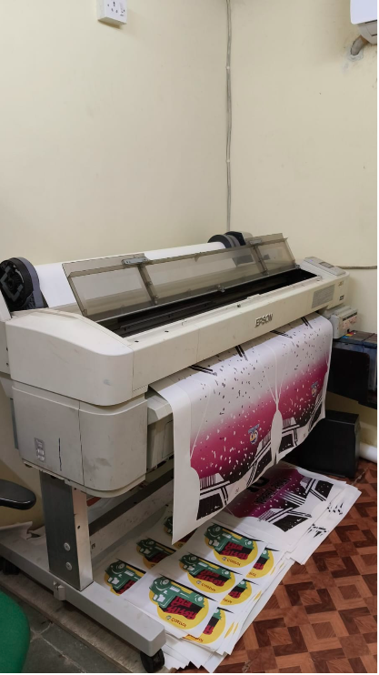 Wide-format sublimation printer producing colourful sportswear transfer prints with DSSNext supplies